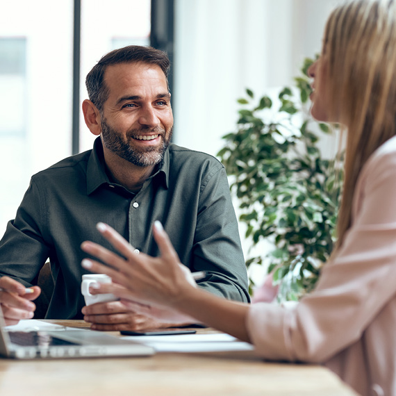 Man and woman discussing payroll